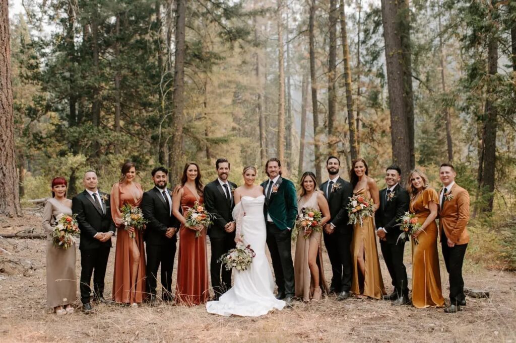 newlyweds with bridesmaids and friends of the groom