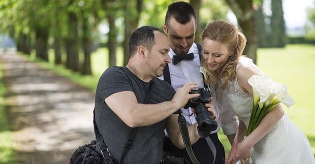 bride and groom and photographer