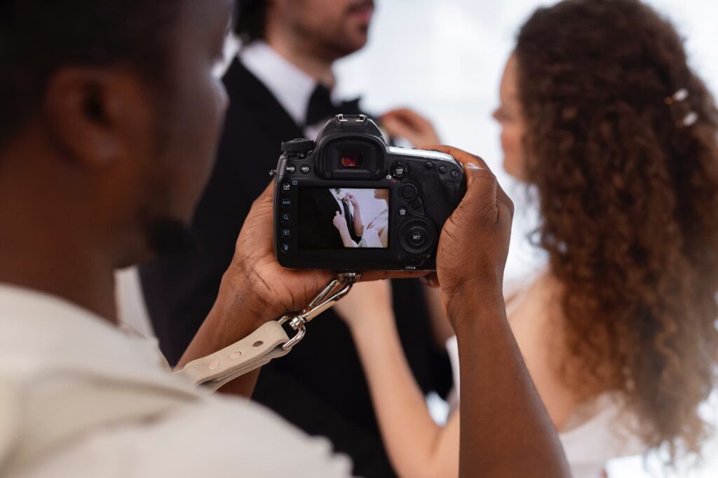 The photographer takes pictures for the bride and groom