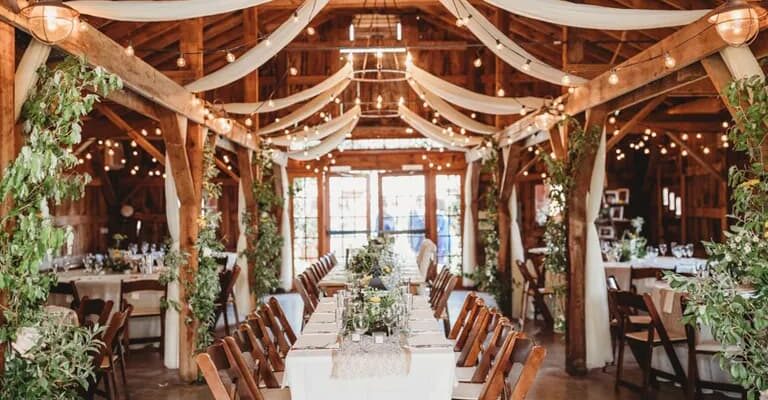 A wooden barn decorated for a wedding