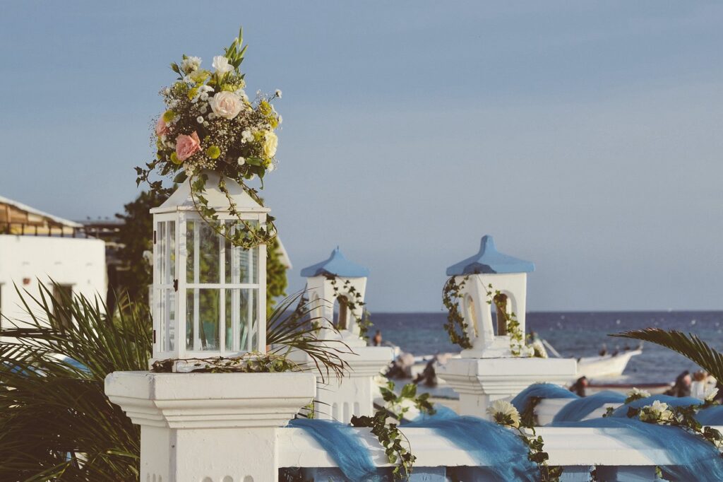 Wedding lamp with flowers against the background of the sea