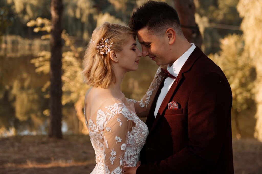 Groom and bride on their wedding day near lake