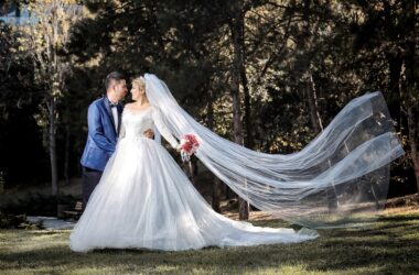 Bride and groom against a background of trees